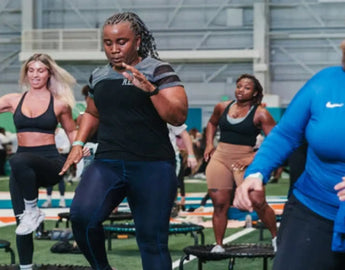 Group of bouncers doing cardio workouts on JumpSport Fitness trampolines.