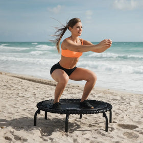 Girl at the beach on a JumpSport 39 inch PRO trampoline model 350 PRO