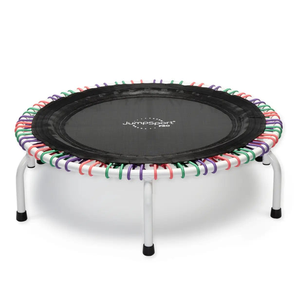 JumpSport 39 inch PRO trampoline model FLORA with a white frame and pink, purple, and green cords laying flat