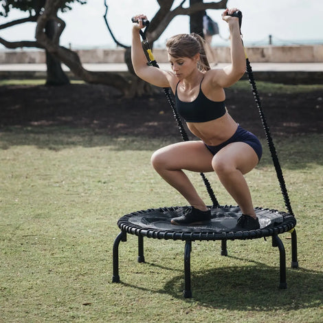 Girl using strength training kit on a JumpSport