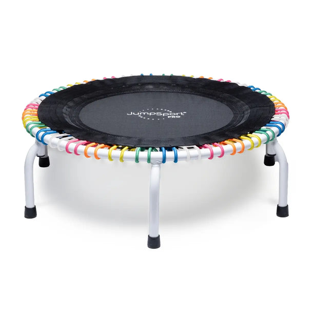 JumpSport 39 inch PRO trampoline model CELEBRATE with a white frame and white, pink, orange, yellow, green and blue cords laying flat