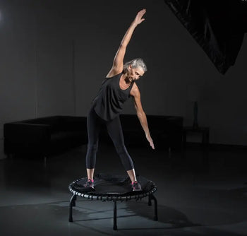 Active aging Lynda stretching on the JumpSport trampoline